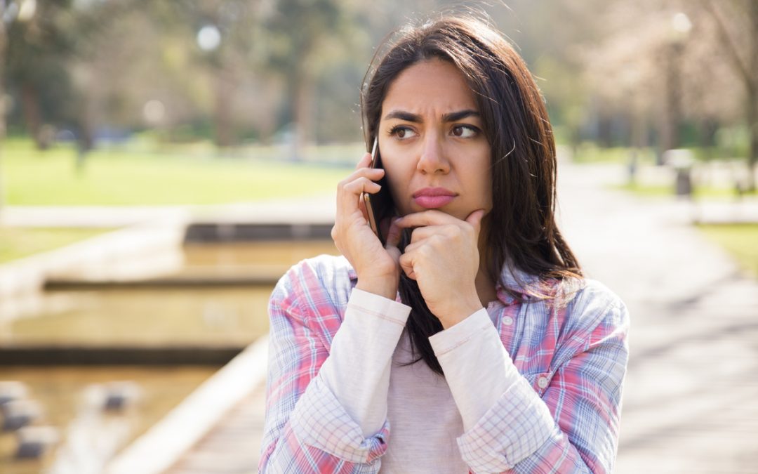 Lady looking concerned about a phone call