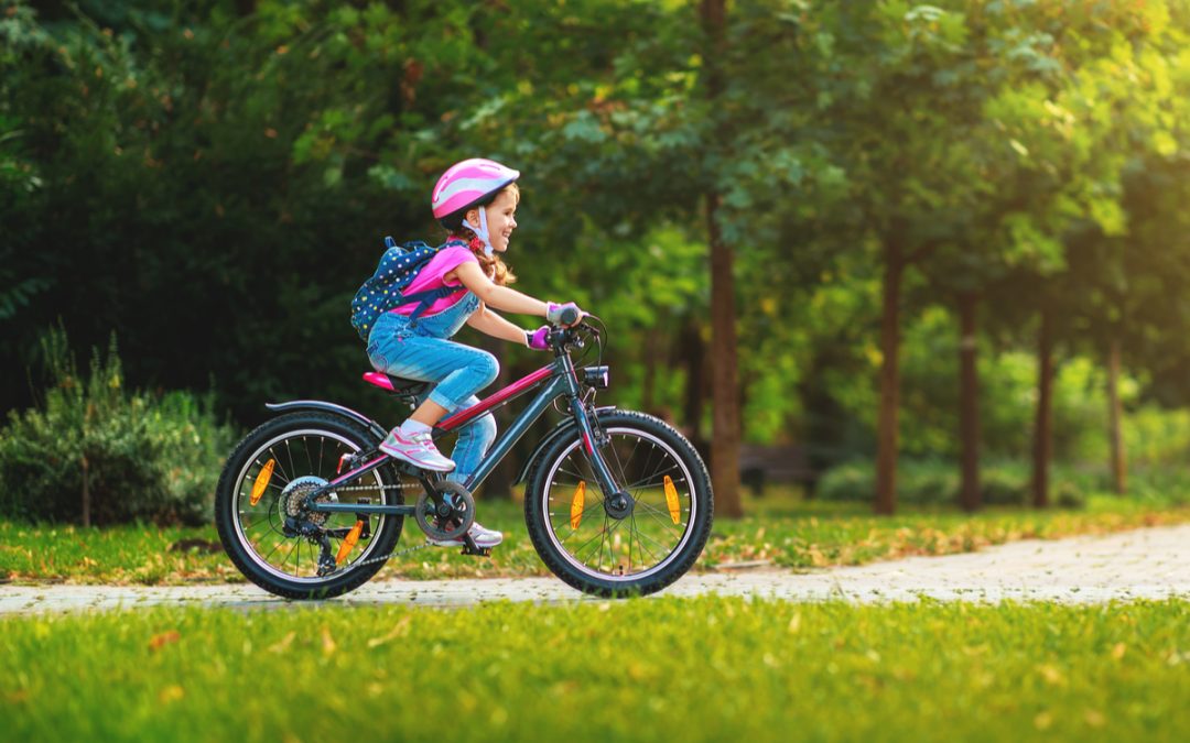 A girl riding a bike.