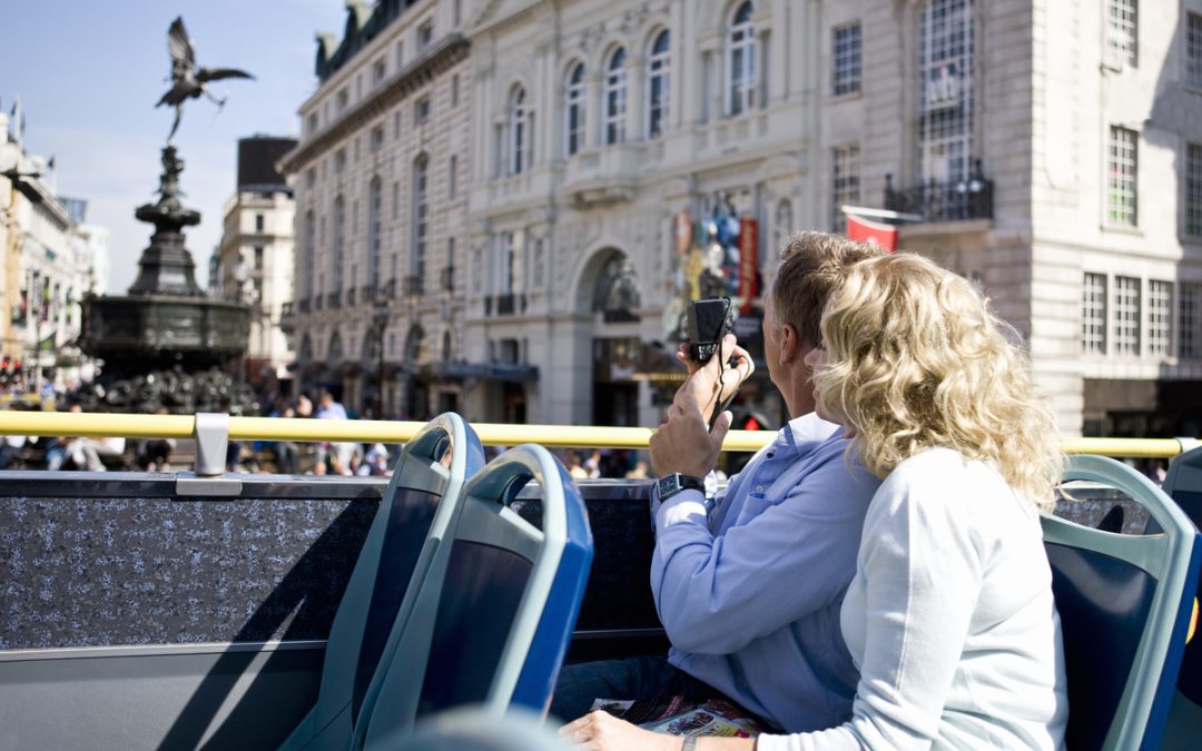 A couple on a sightseeing bus.