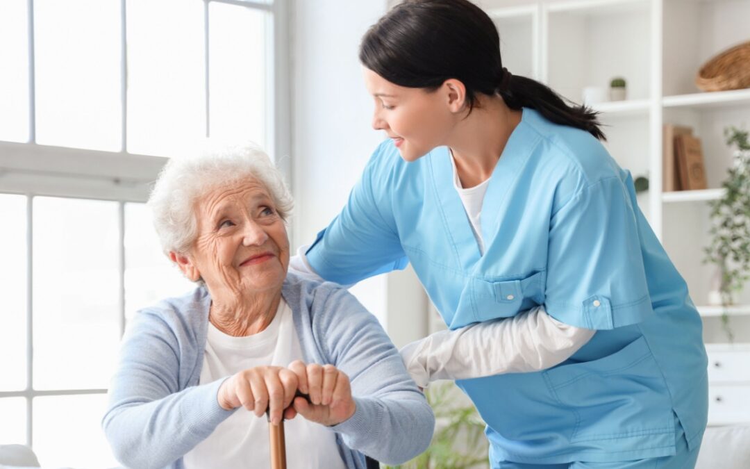 An older woman with a carer.