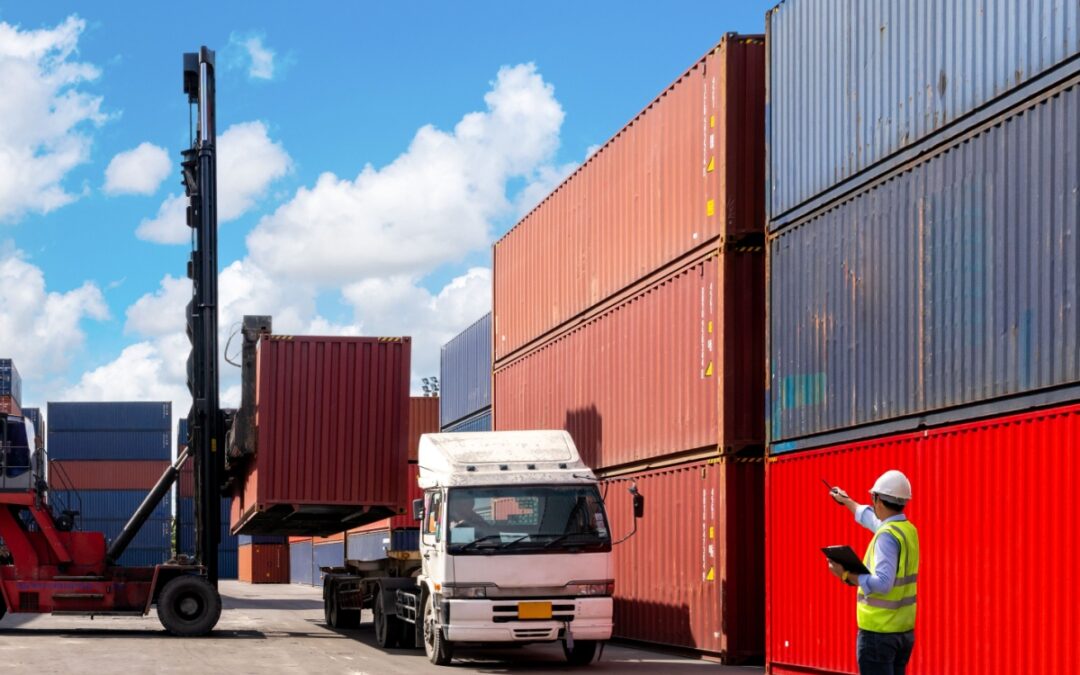 A foreman organising containers from a cargo ship.