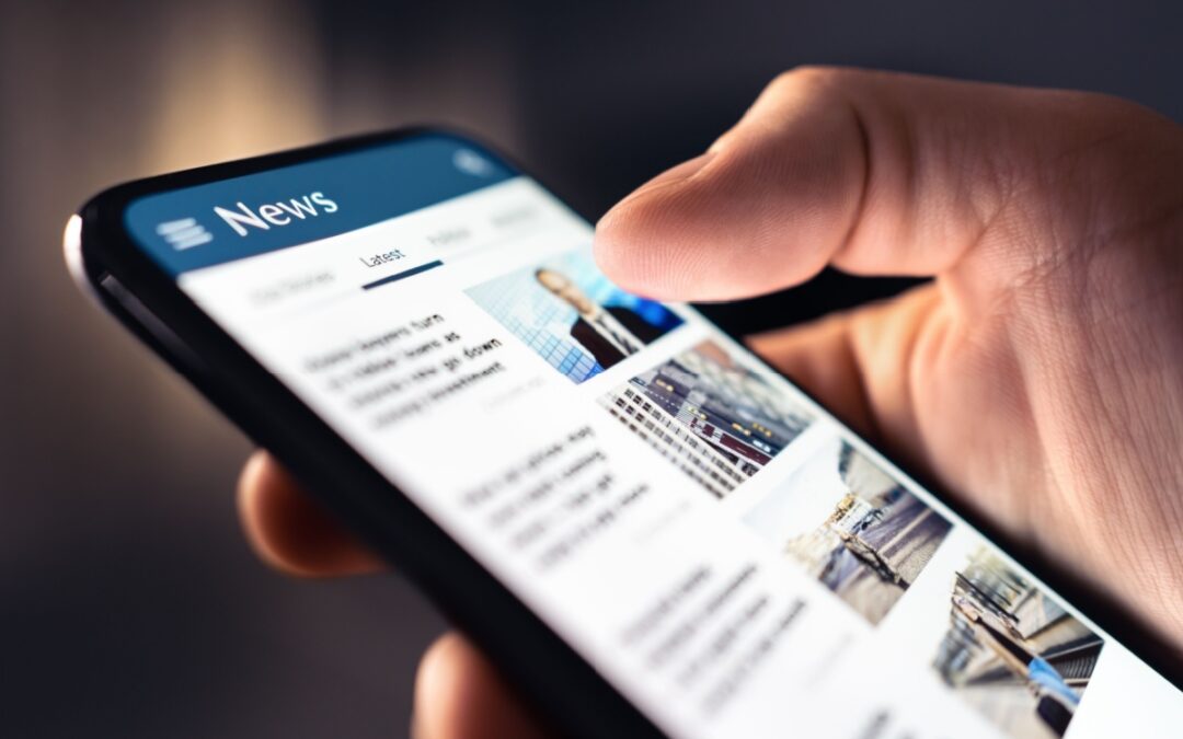 A person looking at a news feed on their phone.