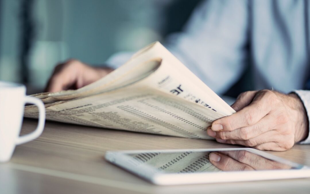 A man reading a newspaper.