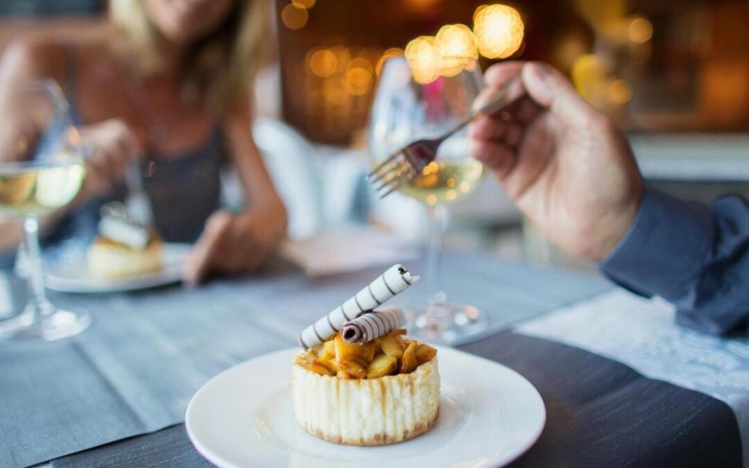 A couple enjoying a meal in a restaurant.